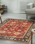 Majestic Versatile Red Hand Knotted Wool Rug, its vibrant red tones and intricate hand-knotted wool texture anchoring a contemporary living room with a warm, luxurious feel.