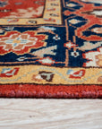 Majestic Versatile Red Hand Knotted Wool Rug, showcasing a vibrant red hue and hand-knotted construction, displayed in a room setting to demonstrate scale and usage.