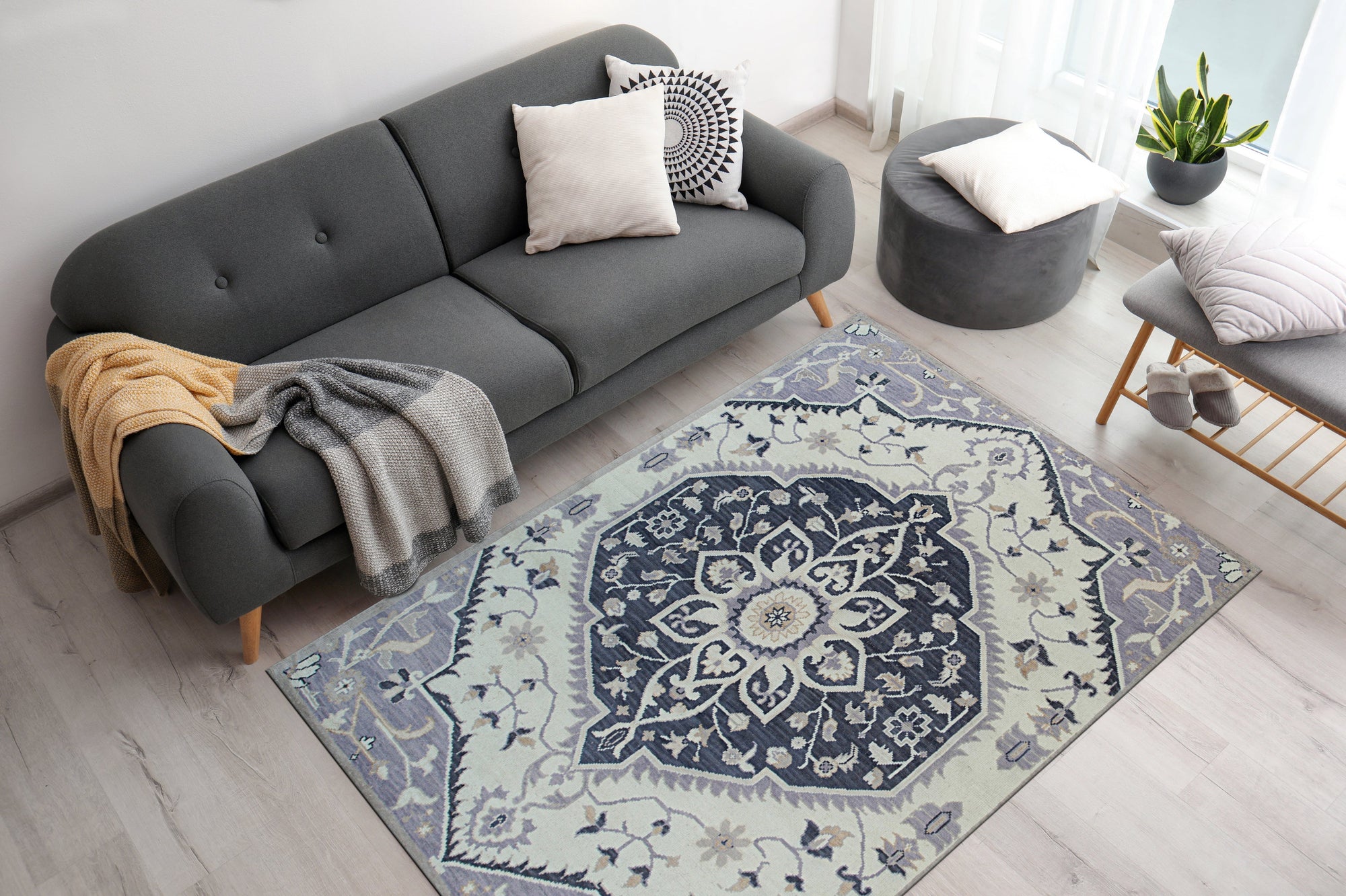 Timeless Oriental Ivory Hand Knotted Wool Rug displayed in a brightly lit living room, its intricate floral design anchoring the space with warmth and subtle elegance.
