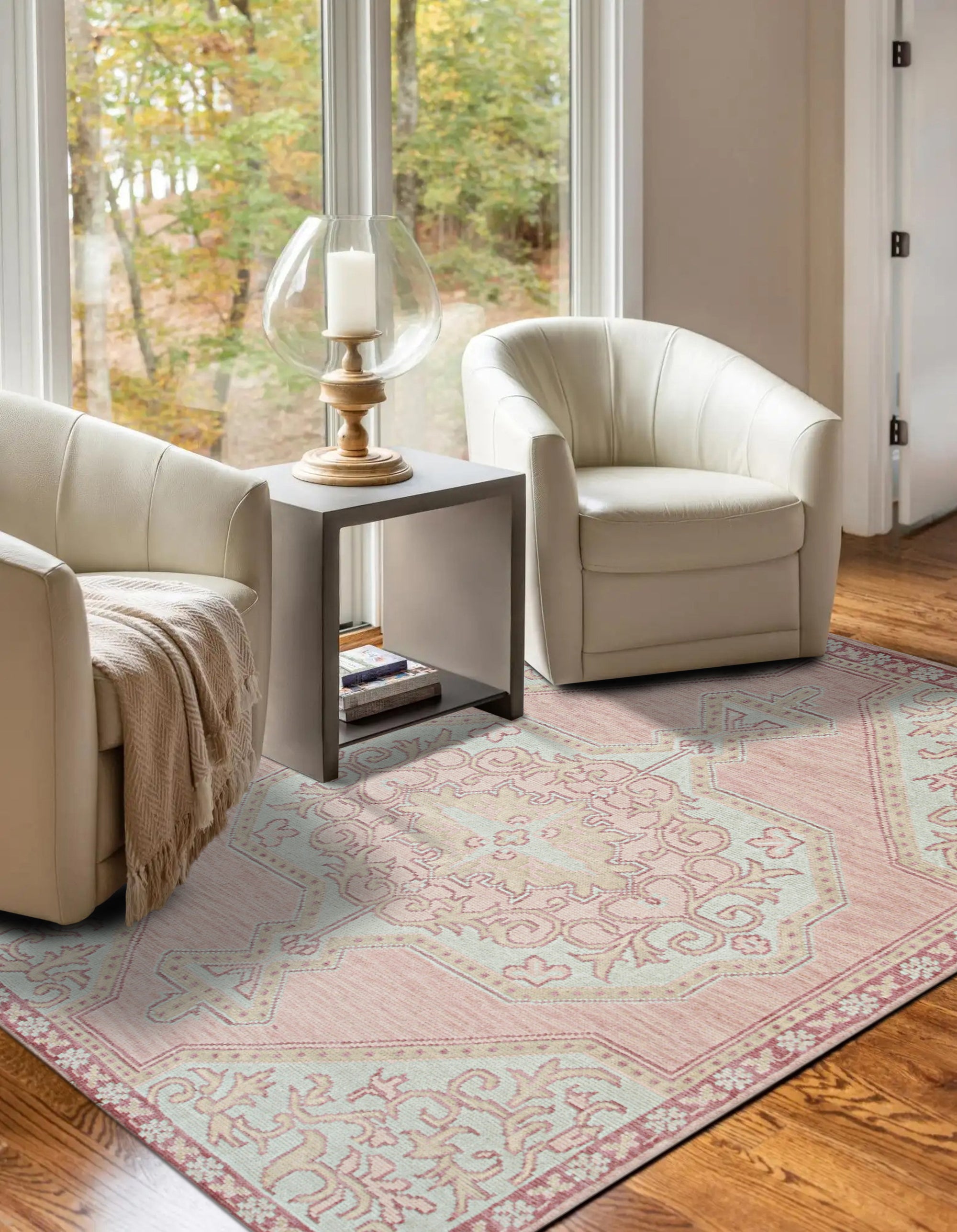 Lydia Oriental Pink Hand Knotted Wool Rug, showcasing a vibrant pink and cream palette with intricate floral and geometric motifs, hand-knotted in wool for luxurious texture and enduring warmth, nestled in a cozy living room setting.