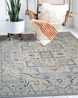 Unique Comfortable Blue Hand Knotted Wool Rug, its vibrant blue hues and intricate hand-knotted wool construction adding warmth and texture to a brightly lit living space.