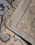 Unique Comfortable Blue Hand Knotted Wool Rug, vibrant indigo hues blend in a plush, hand-knotted texture, radiating warmth and inviting comfort within a bright, modern living space.