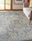 Unique Comfortable Blue Hand Knotted Wool Rug, a field of deep blue, hand-knotted wool, accented with subtle variations in tone, seen in a lifestyle setting.