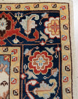 Handcrafted Xena Ivory Hand Knotted Wool Rug, showing intricate details of its hand-knotted construction and subtle ivory hues, displayed in a bright, inviting living room setting.