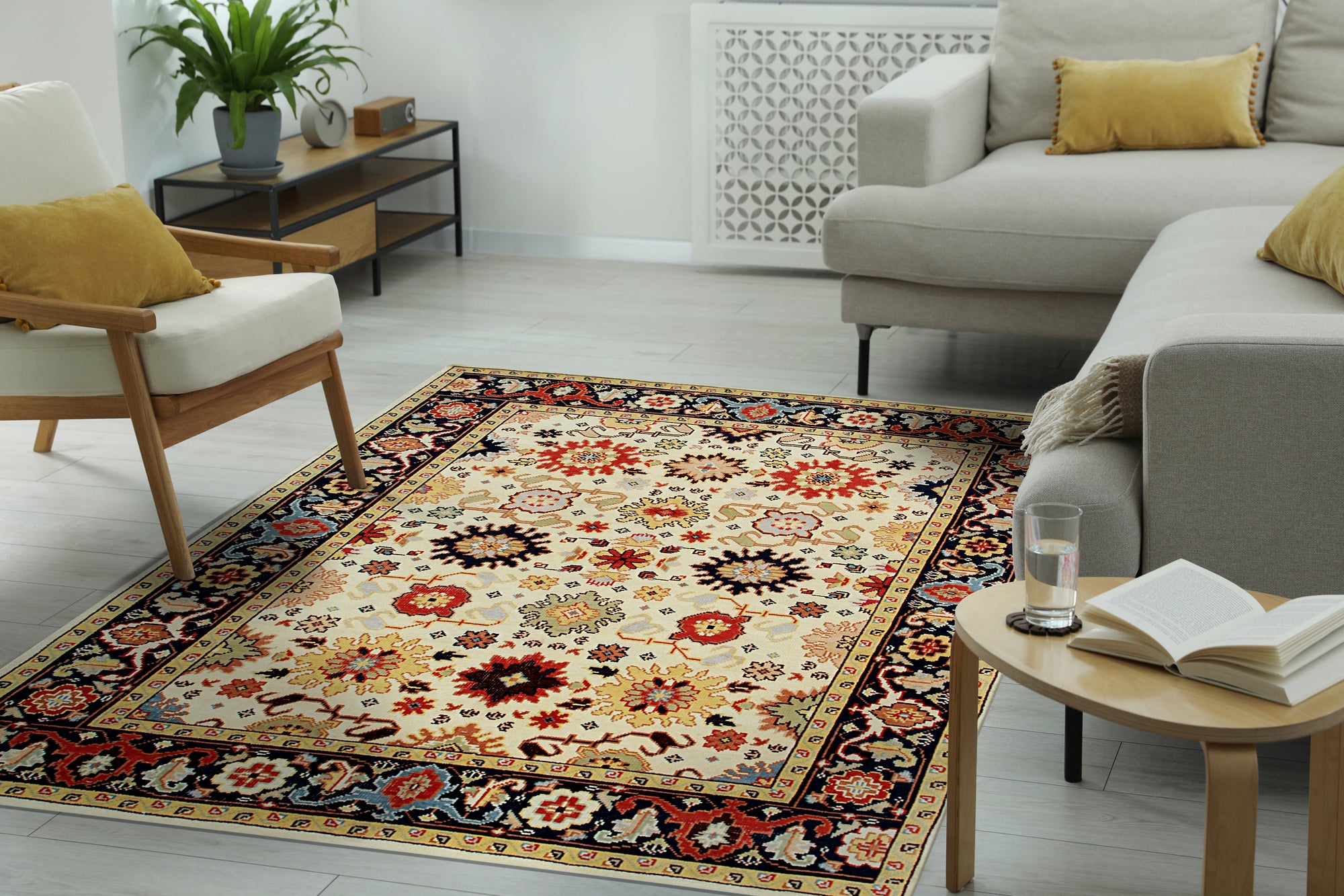 Violet Traditional Ivory Hand Knotted Wool Rug displayed in a well-lit living space. Hand-knotted wool construction highlights intricate floral patterns in ivory and subtle violet accents, complementing the room's neutral decor.