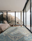 Bianca Oriental Ivory Hand Knotted Wool Rug, its intricate patterns unfolding in soft ivory tones across a finely crafted wool surface, presented in a room setting.