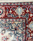 Timeless Cozy Ivory Hand Knotted Wool & Silk Rug, soft ivory hues and intricate hand-knotted details create a luxurious texture, seen in a bright, inviting living space.