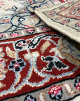 Timeless Cozy Ivory Hand Knotted Wool & Silk Rug, showing subtle texture and sheen in a room setting, highlighting its soft ivory tones and handcrafted construction.