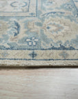 Celia Traditional Beige Hand Knotted Wool Rug, its intricate pattern and warm beige tones complementing a light-filled living space.