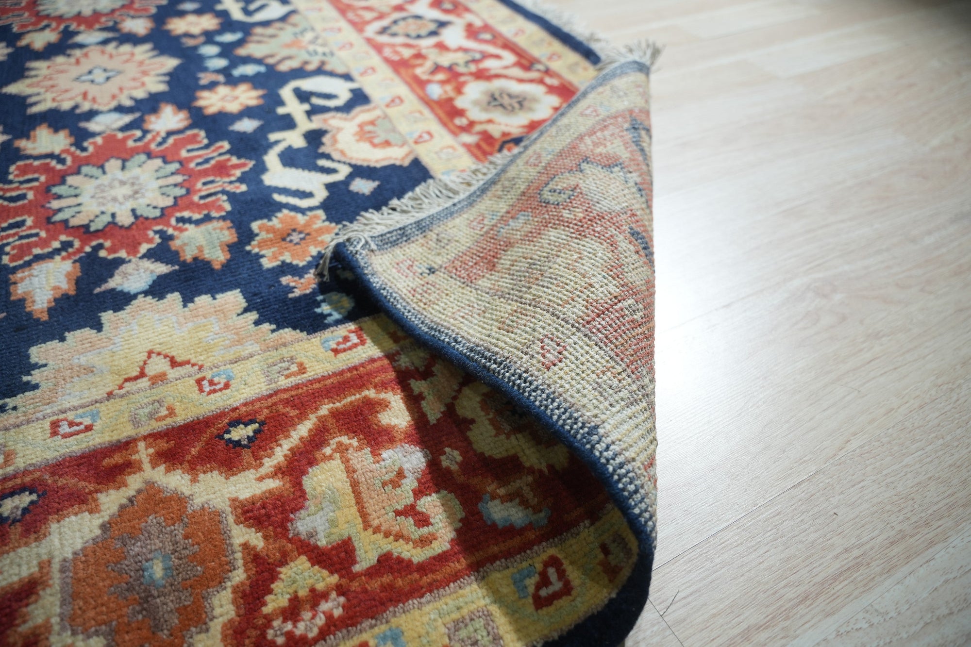 Chloe Amara Navy Hand Knotted Wool Rug, showcasing its intricate design and rich navy hue, displayed as the sixth product view.