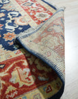 Chloe Amara Navy Hand Knotted Wool Rug, showcasing its intricate design and rich navy hue, displayed as the sixth product view.