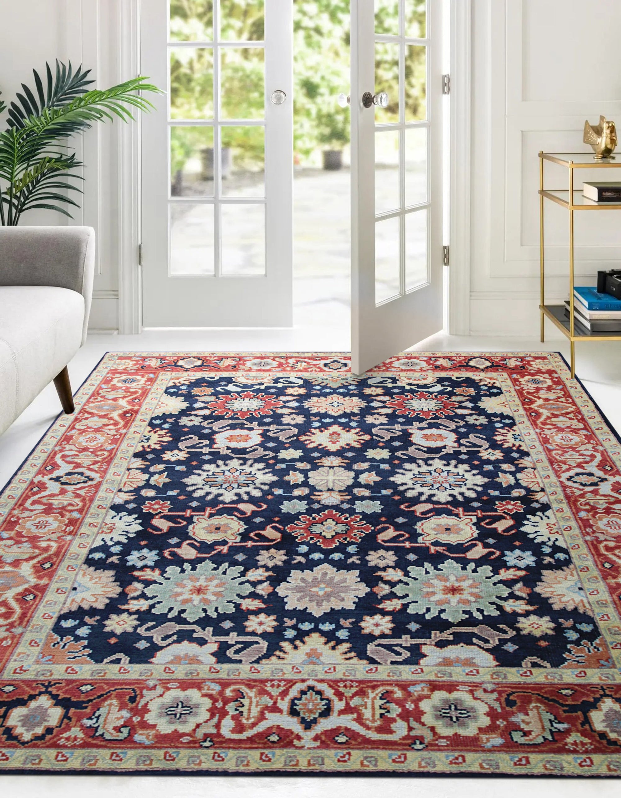 Chloe Amara Navy Hand Knotted Wool Rug, its intricate pattern unfolding across a softly lit floor, showcasing the rug's rich navy hues and textured wool construction within an elegant interior setting.
