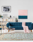Brenda Xena Blue Hand Tufted Wool Rug, showcasing a dynamic blend of blues and creams in a modern, abstract pattern, situated in a bright living room with neutral furniture.