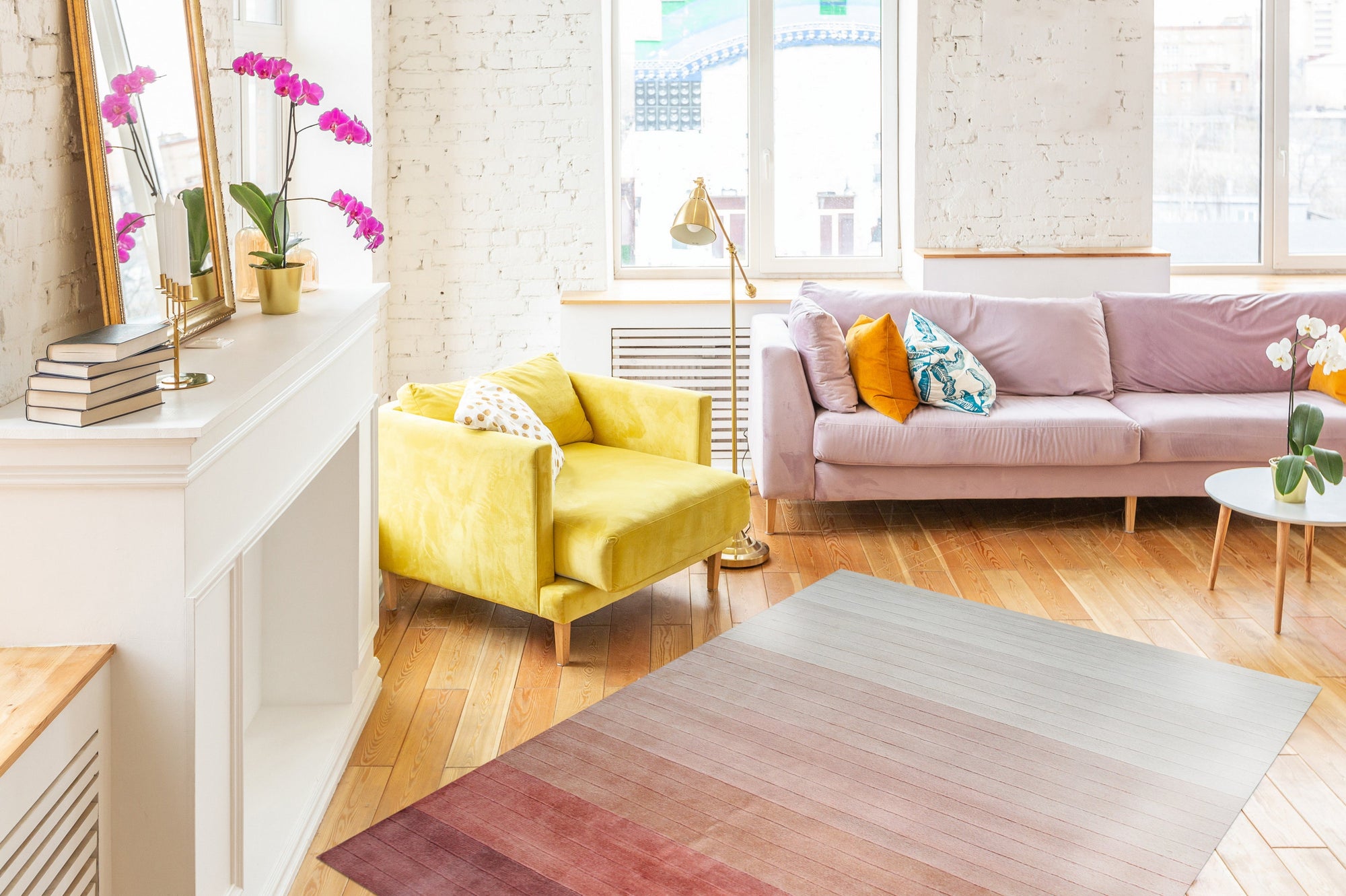 Isla Striped Rust Hand Tufted Wool Rug displayed on a light wooden floor, its warm rust and beige stripes adding textured comfort to the space. Hand tufted wool construction evident in the rug's plush pile.