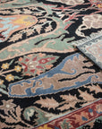 Sophisticated Timeless Black Hand-Knotted Wool Rug, its intricate patterns revealed in close detail, showcasing the rug's texture and handcrafted quality.