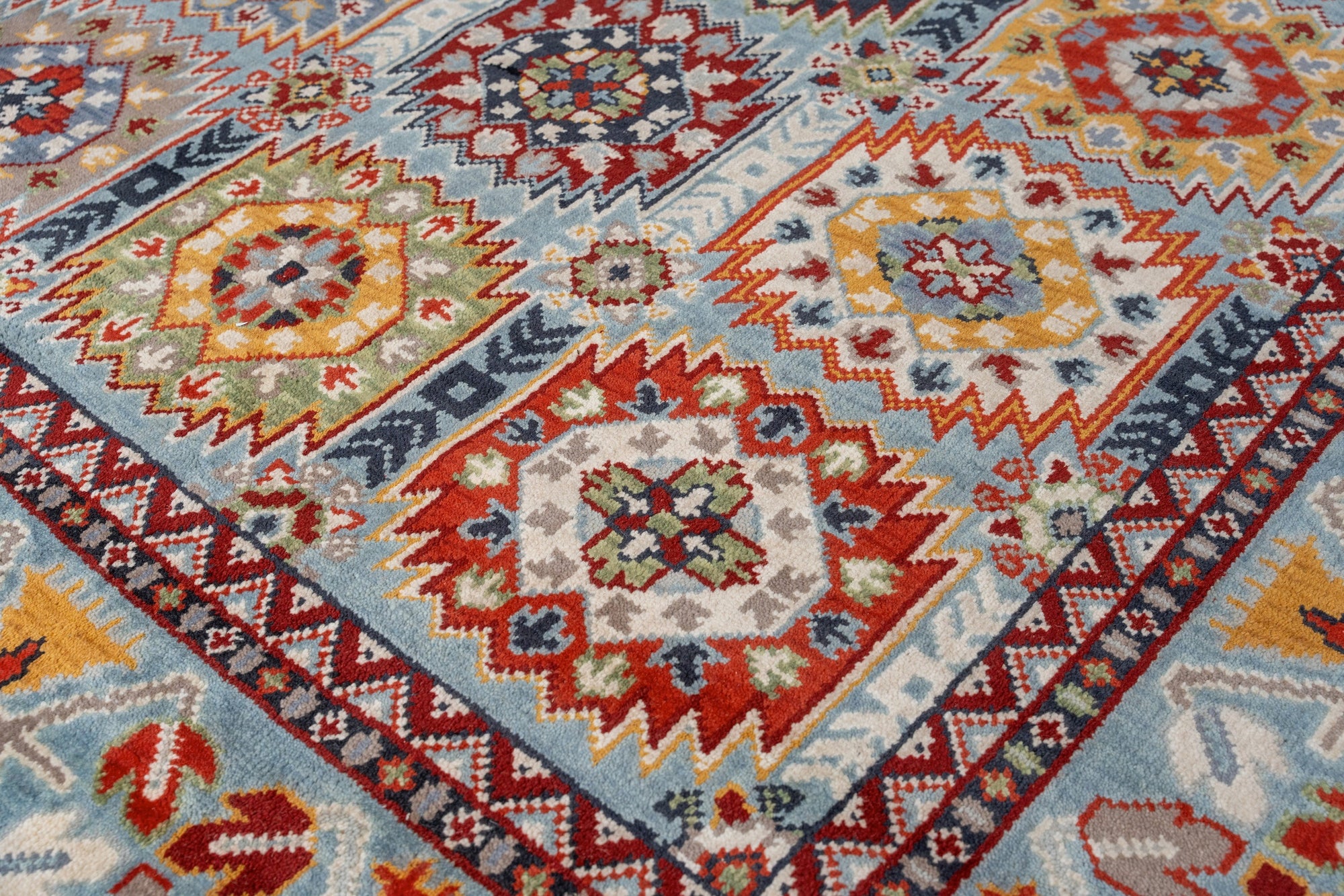 Modern Stylish Blue Hand-Knotted Wool Rug, a vibrant blue wool rug featuring a modern pattern, enriching a contemporary living space.