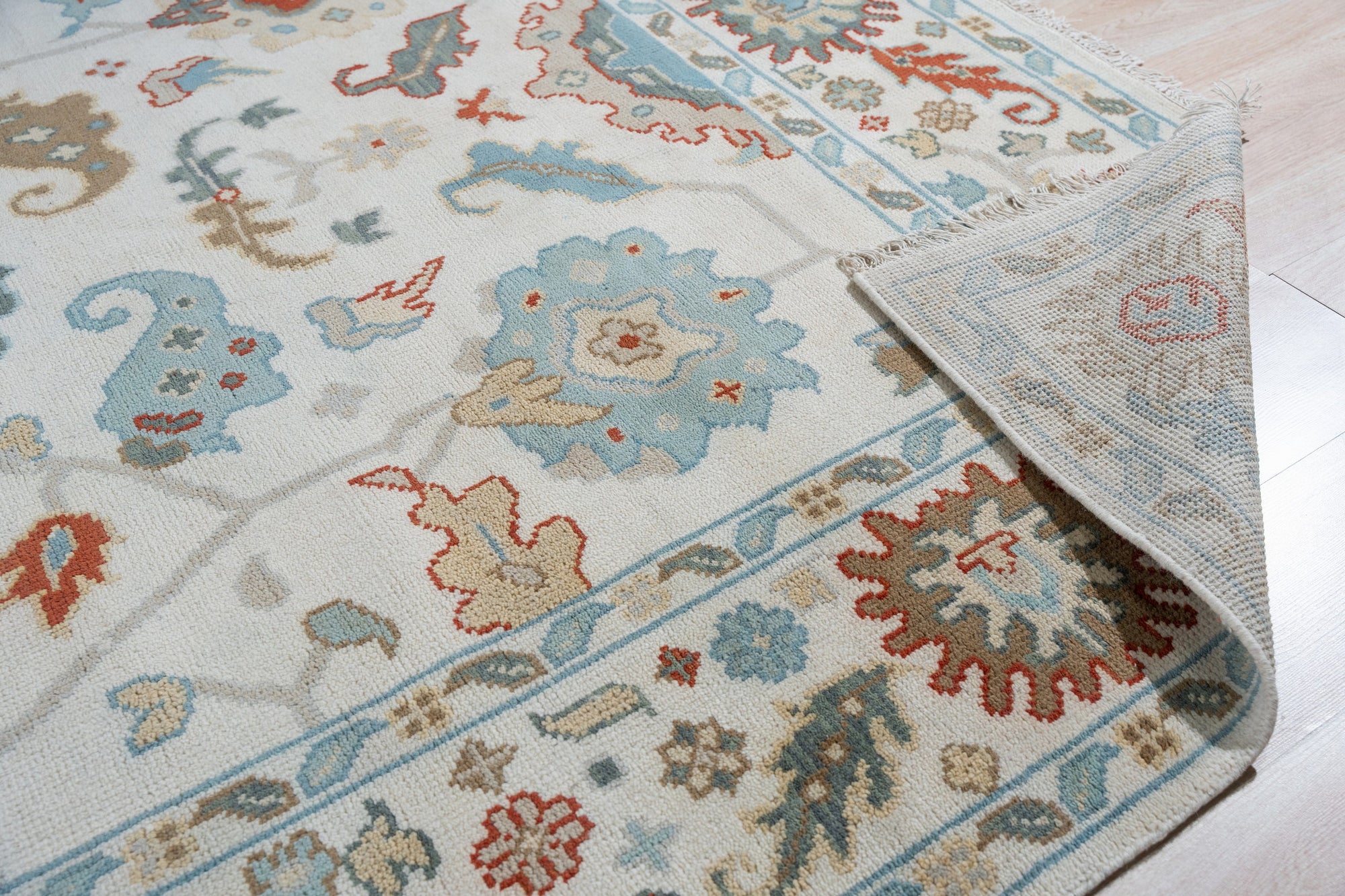 Stylish Sophisticated Beige Hand-Knotted Wool Rug, a beige wool rug with subtle design variations and texture visible in a detailed close-up.