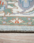 Stylish Elegant Blue Hand-Knotted Wool Rug, a vibrant blue wool rug with a detailed, traditional design, bathed in soft light that highlights its intricate hand-knotted construction.