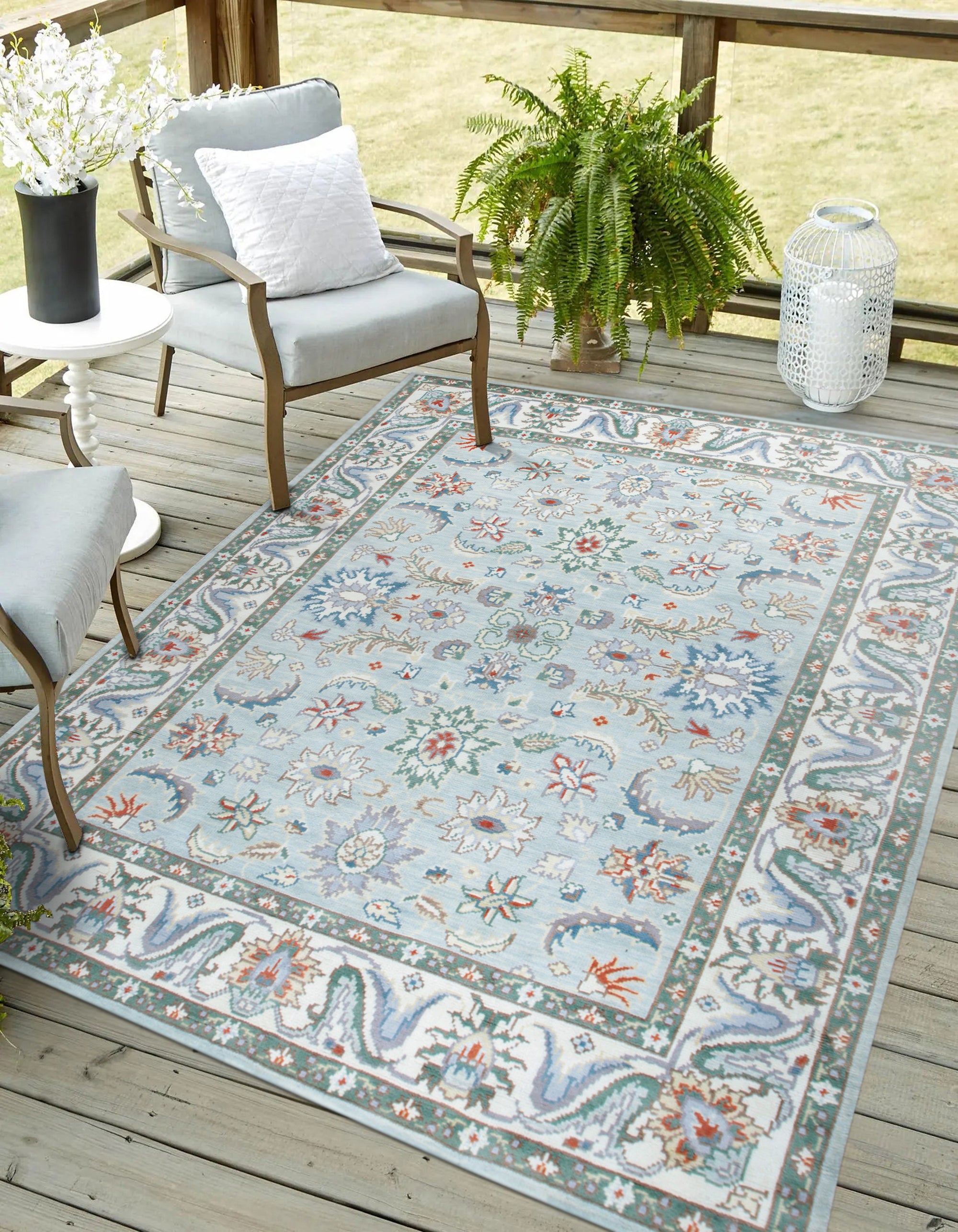 Stylish Elegant Blue Hand-Knotted Wool Rug displayed on a light wooden floor, showcasing its intricate hand-knotted construction and rich blue hues.