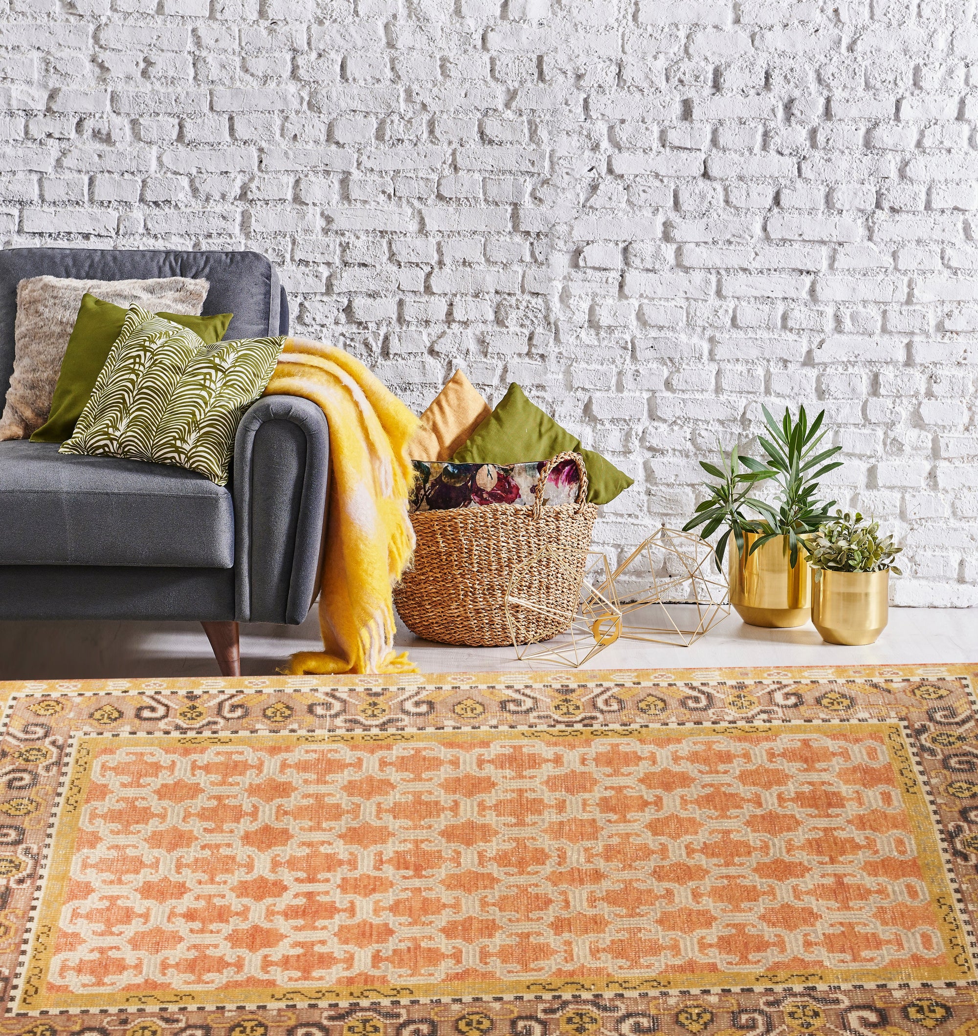 Jade Oriental Rust Hand Knotted Wool Rug displayed; hand-knotted wool construction in rich rust hues reveals intricate oriental designs, adding warmth and texture to the setting.