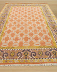 Jade Oriental Rust Hand Knotted Wool Rug, a richly textured wool rug featuring a vibrant rust palette and intricate oriental design, displayed in a room setting, highlighting its warm tones and hand-knotted construction.
