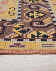 Jade Oriental Rust Hand Knotted Wool Rug, its intricate floral patterns and warm rust hues displayed, grounding a modern living space with traditional elegance.