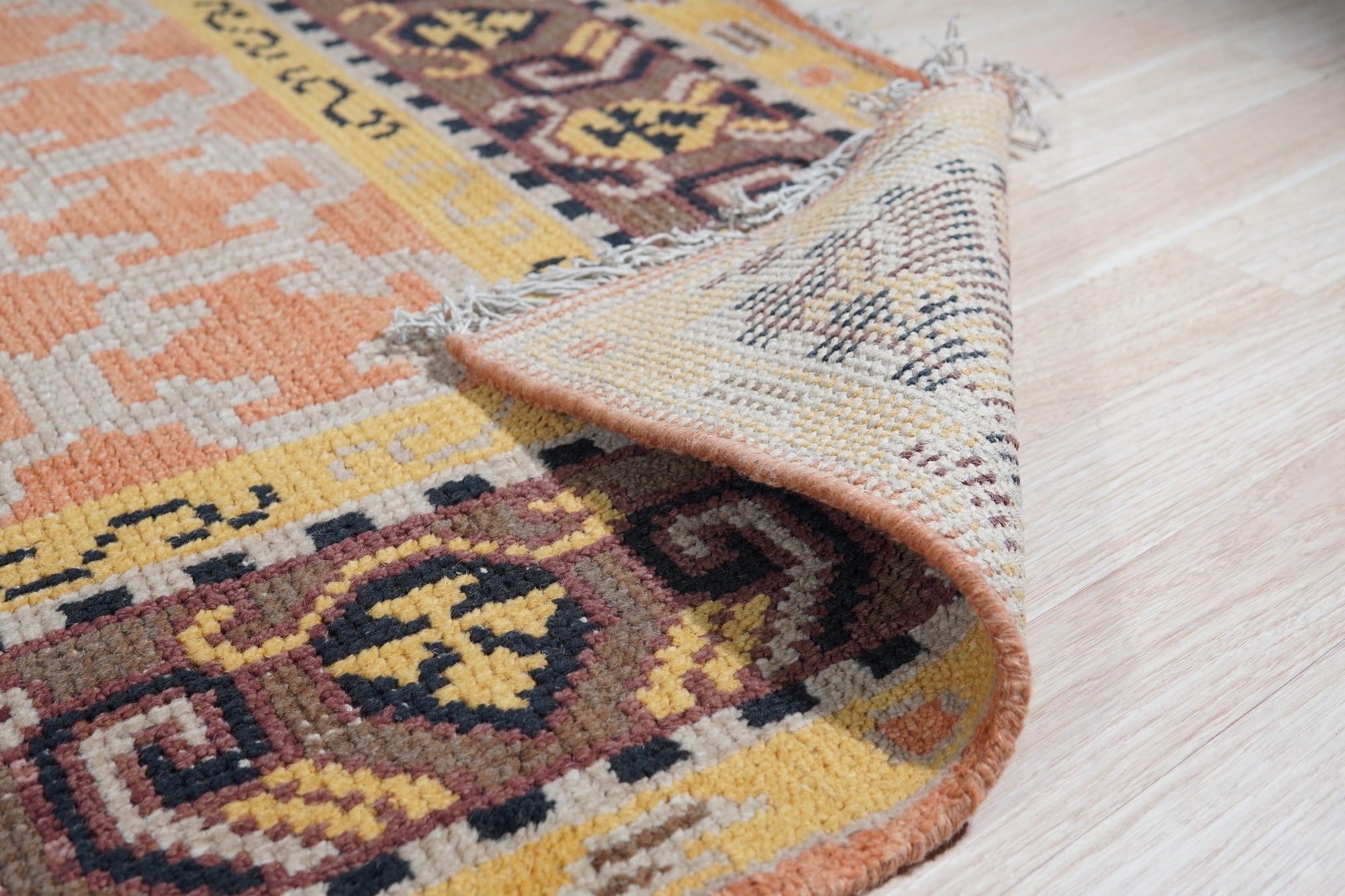 Jade Oriental Rust Hand Knotted Wool Rug, showcasing its intricate oriental pattern in warm rust tones, its hand-knotted wool construction evident in its rich texture and detailed craftsmanship.