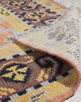 Jade Oriental Rust Hand Knotted Wool Rug, a richly colored wool rug with intricate oriental patterns, displayed in a brightly lit room setting.