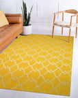 Xena Timeless Yellow Hand Knotted Rug displayed in a brightly lit living space. Warm yellow tones and intricate hand-knotted design visible, softening the room with its classic aesthetic.