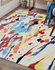 Ophelia Radiant Multicolor Hand Tufted Rug, displaying vibrant shades and intricate hand-tufted detailing, seen in a bright, modern living room setting.