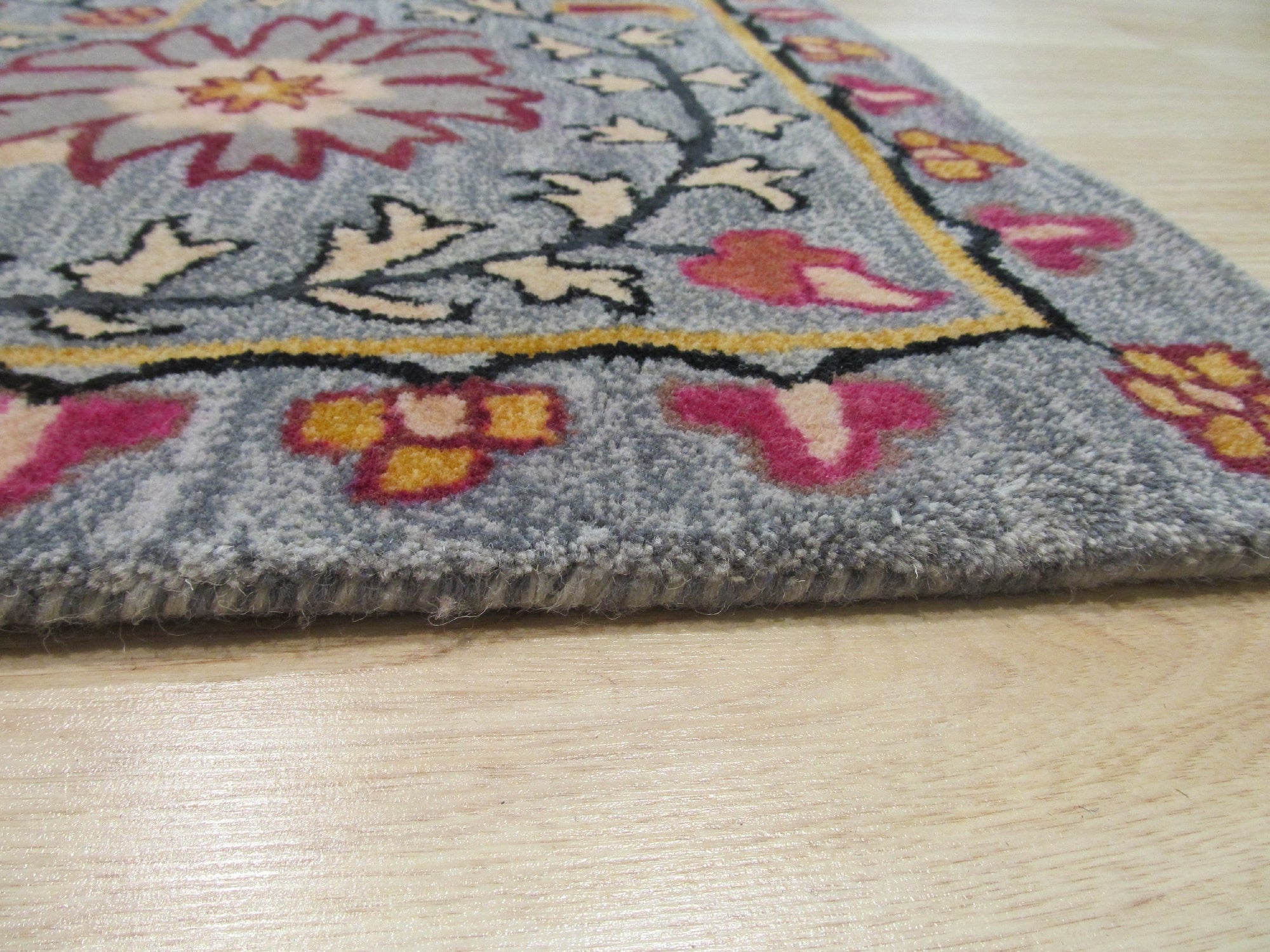Maya Timeless Blue Hand Tufted Wool Rug, a calming blue wool rug with a timeless design, enriching a neutral living space.