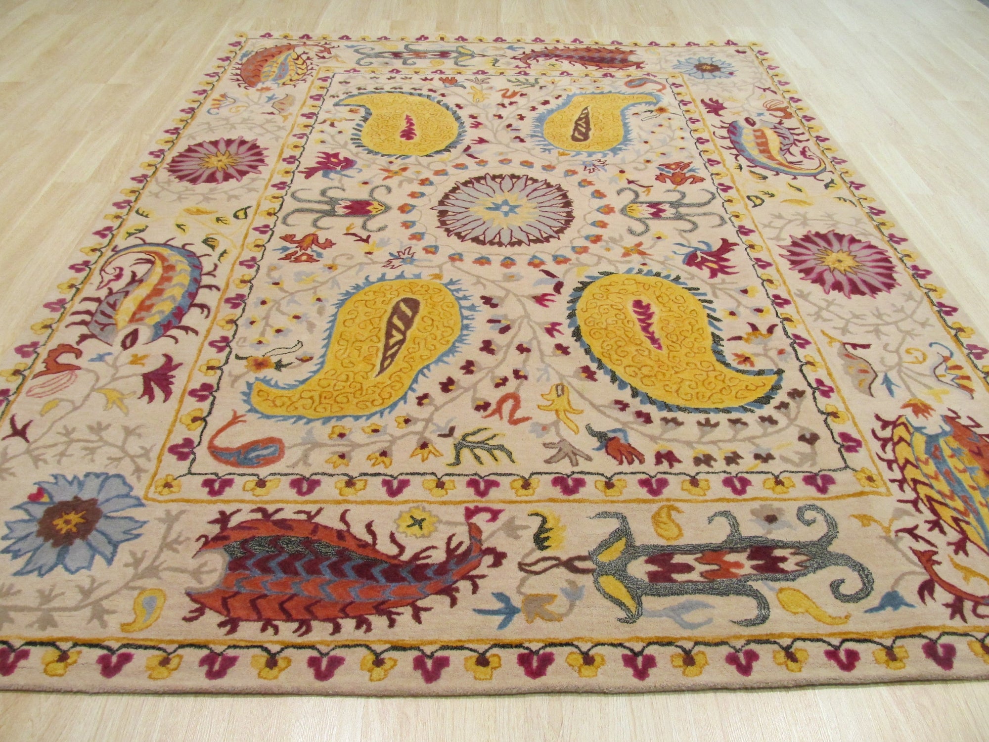 Chic Delicate Ivory Hand Tufted Wool Rug, an ivory wool rug showcasing its delicate hand-tufted construction, blends seamlessly into a bright, airy living space.