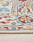 Ruby Fiona Ivory Hand Tufted Wool Rug, showcasing subtle textures and an elegant ivory palette, subtly grounded in a minimalist modern living space.
