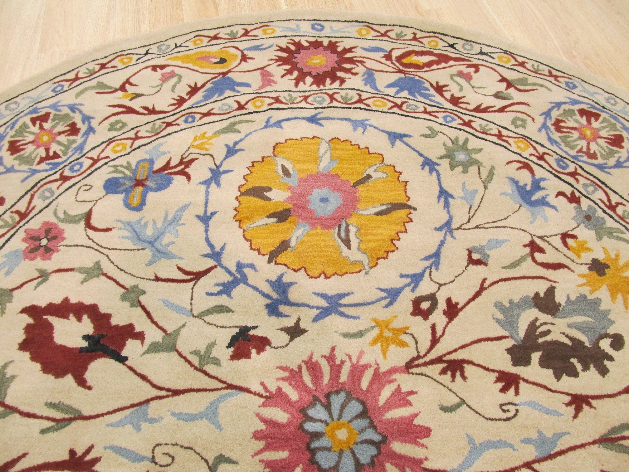 Ruby Fiona Ivory Hand Tufted Wool Rug, ivory wool floor covering with a subtly textured, geometric design, complementing a modern living space with light wood furniture and pops of teal.