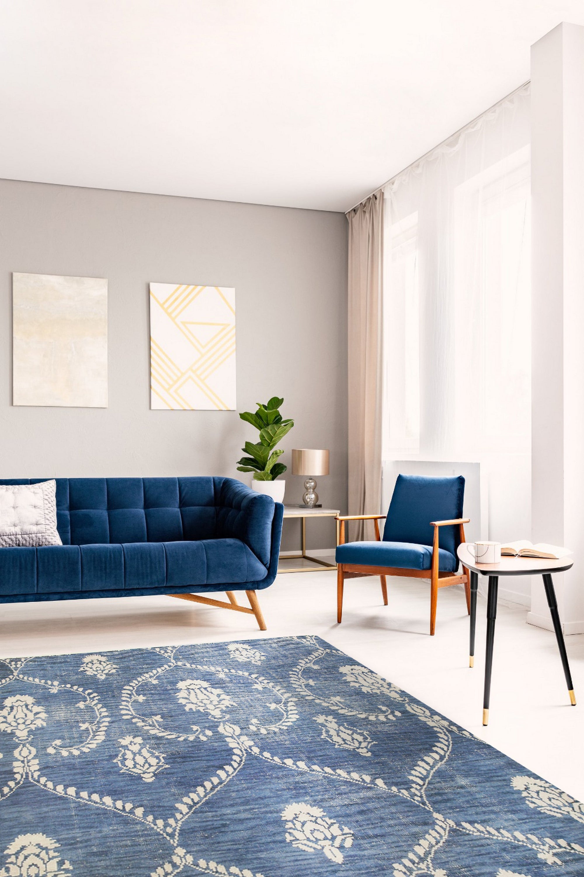 Luxurious Chloe Blue Hand Knotted Wool Rug, showcasing intricate patterns in calming blues and creams, elegantly adorns a modern living space.
