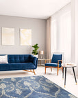 Luxurious Chloe Blue Hand Knotted Wool Rug, showcasing intricate patterns in calming blues and creams, elegantly adorns a modern living space.