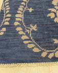 Luxurious Chloe Blue Hand Knotted Wool Rug, its cool blue tones and intricate hand-knotted detail softening a contemporary living space.