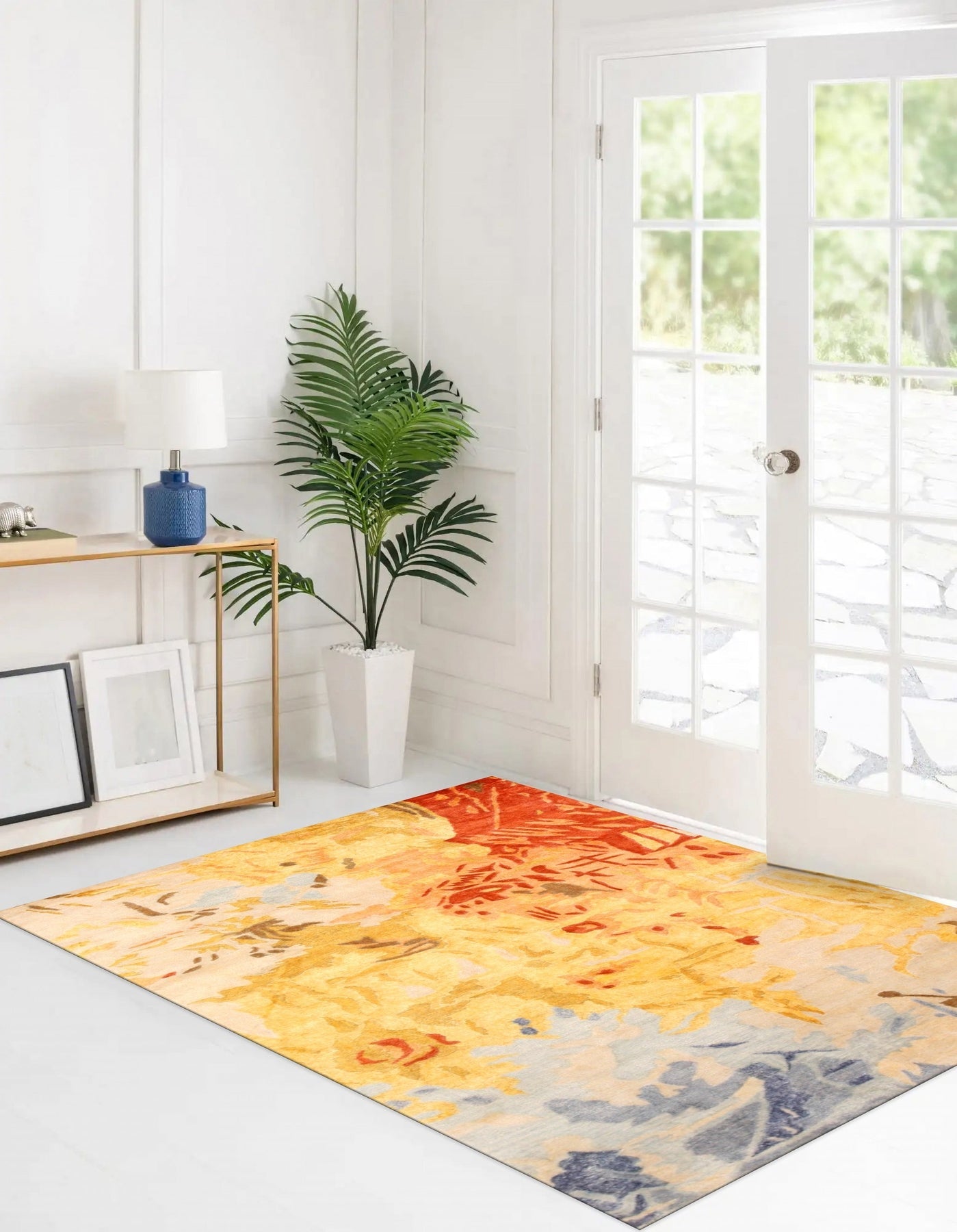 Kira Quinn Gold Hand Tufted Rug, showcasing a luxurious gold hue and intricate hand-tufted construction, graces a modern living room setting.