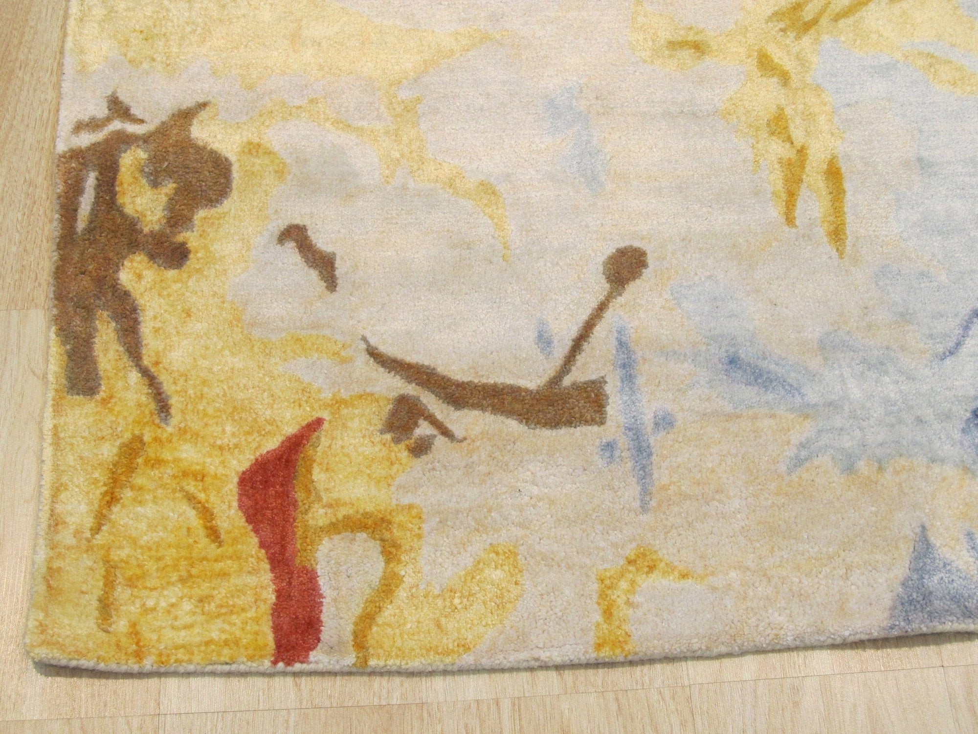 Here's the alt text based on your instructions, given that the image position is 3:
 
 Kira Quinn Gold Hand Tufted Rug, warm gold tones and intricate hand-tufted details lending sophisticated texture to a modern living space.