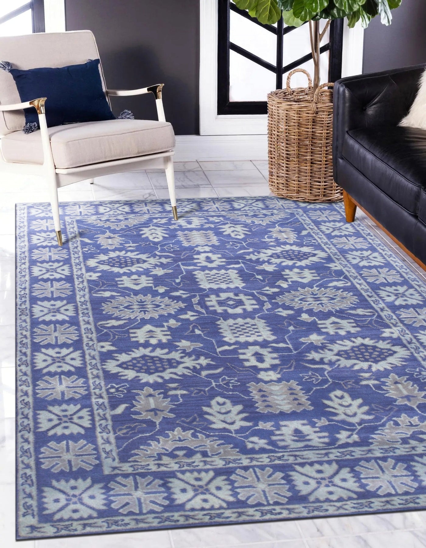 Rustic Oriental Blue Hand Tufted Wool Rug sprawls across a hardwood floor, its intricate blue patterns and hand-tufted texture adding warmth and character to the room's decor.