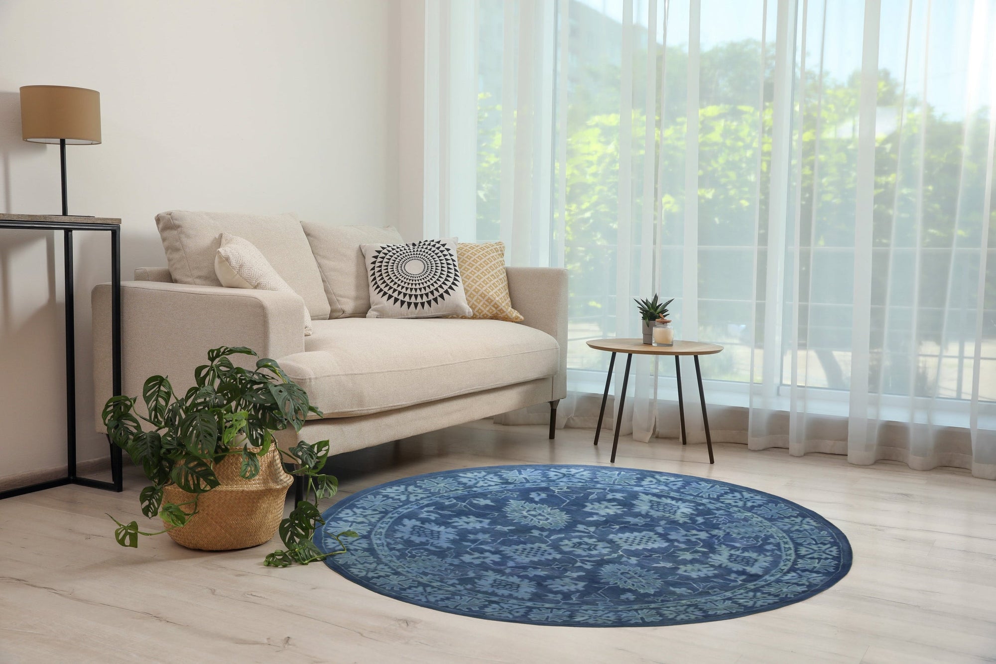 Rustic Oriental Blue Hand Tufted Wool Rug displayed in a bright room, its intricate blue pattern grounding a modern living space.