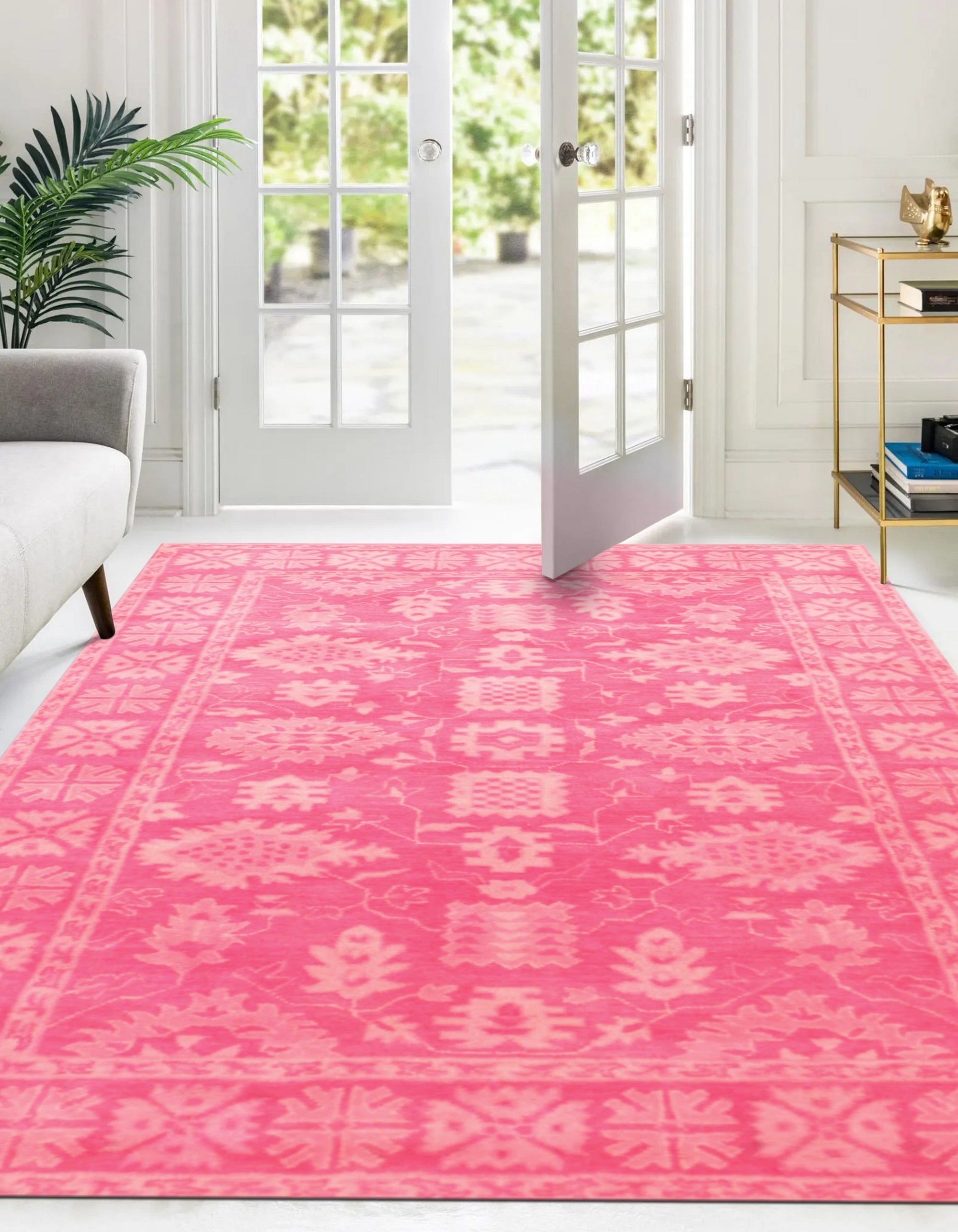 Opulent Oriental Pink Hand Tufted Wool Rug, a pink and wool rug with an oriental design, seen in a well-lit interior setting, showcasing intricate detailing and soft texture.