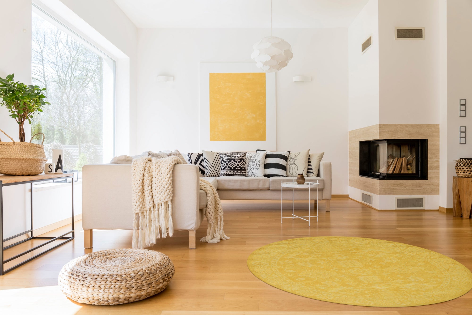 Comfortable Oriental Yellow Hand Tufted Wool Rug, showcasing intricate floral motifs in warm yellow hues, hand-tufted for plush texture and enduring comfort, positioned in a bright, naturally lit living room.