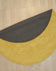 Comfortable Oriental Yellow Hand Tufted Wool Rug, showcasing a vibrant, hand-tufted wool rug with intricate oriental patterns in shades of yellow, gold, and muted browns, adding warmth and texture to a brightly lit room.