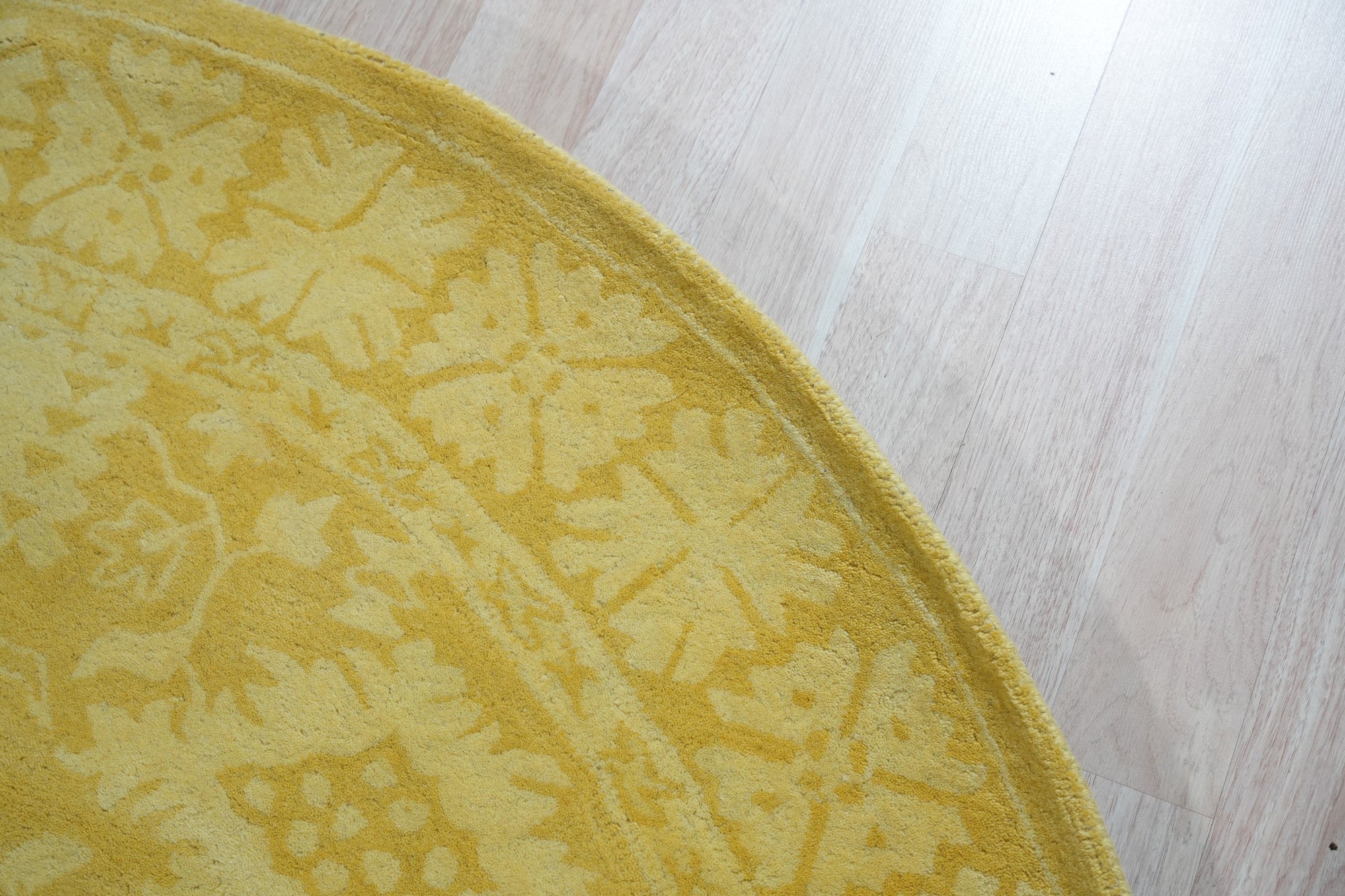 Comfortable Oriental Yellow Hand Tufted Wool Rug, a vibrant yellow wool rug with a classic oriental pattern, gracing a warmly lit interior space.