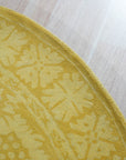 Comfortable Oriental Yellow Hand Tufted Wool Rug, a vibrant yellow wool rug with a classic oriental pattern, gracing a warmly lit interior space.