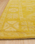 Comfortable Oriental Yellow Hand Tufted Wool Rug, showcasing its vibrant yellow hue and intricate hand-tufted design details in a cozy living room setting.
