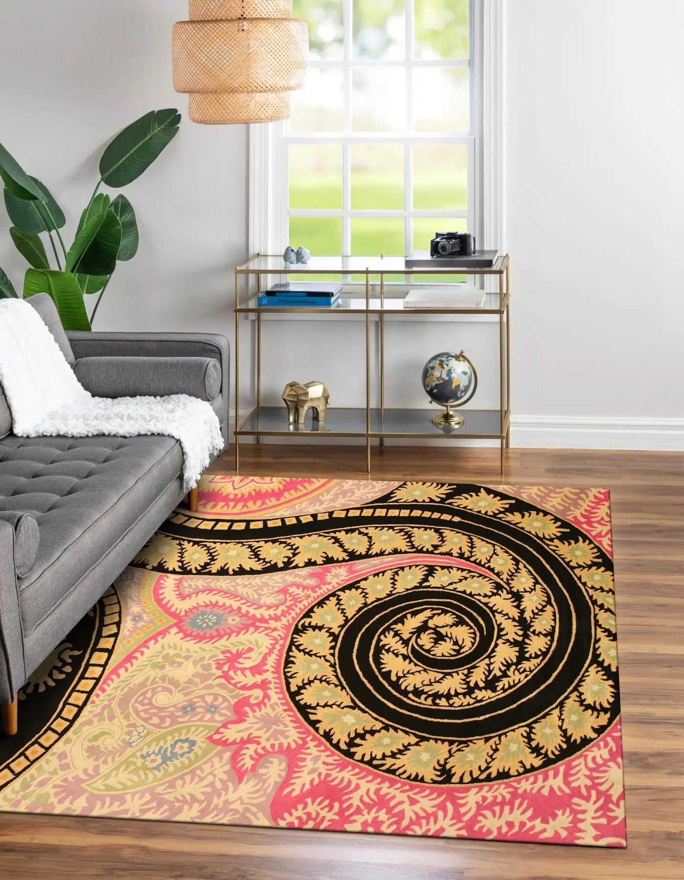Opulent Nina Black Hand Tufted Wool Rug in a brightly lit living room setting, its intricate pattern adding depth and texture to the space.