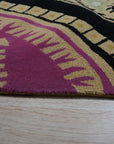 Opulent Nina Black Hand Tufted Wool Rug, showcasing its intricate, possibly geometric, design in a living room setting, likely placed under furniture and providing warmth to the space.