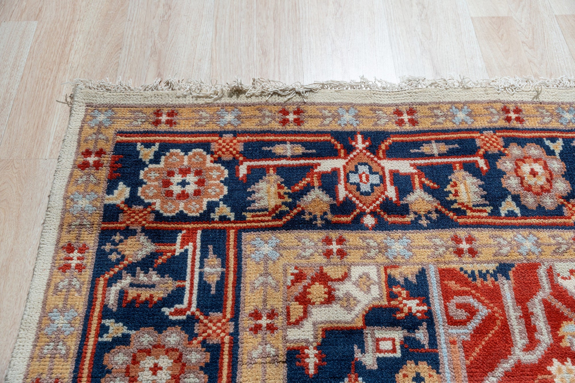 Classic Elegant Blue Hand-Knotted Wool Rug, its intricate patterns unfolding in a living room setting, a harmonious blend of blue tones and classic design.